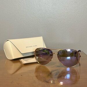 Michael Kors purple sunglasseses in case